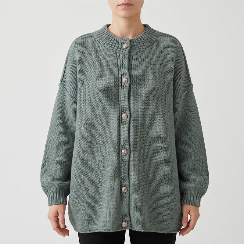 Green knit cardigan on an off-gray studio background - 2
