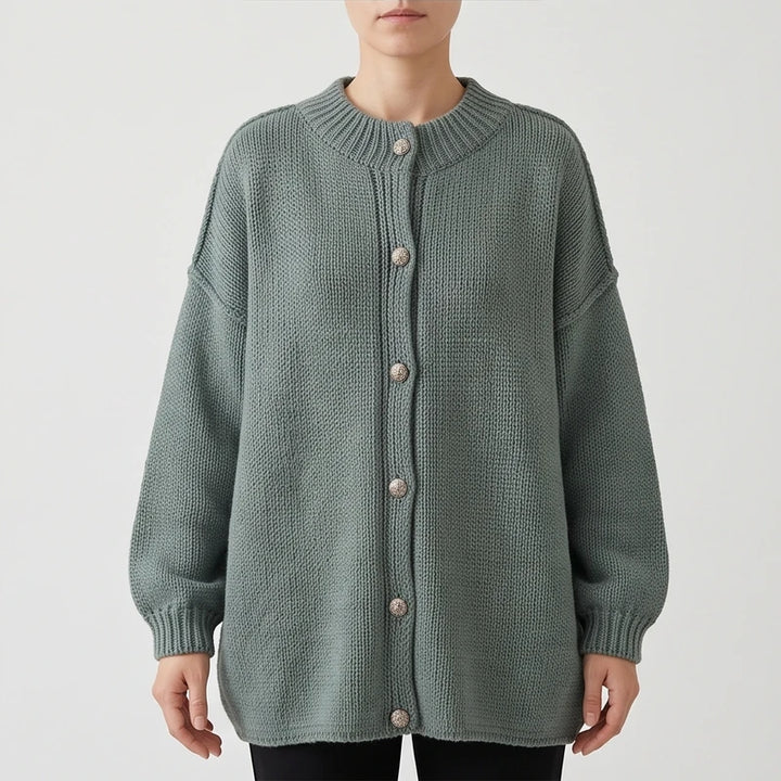 Green knit cardigan on an off-gray studio background - 2