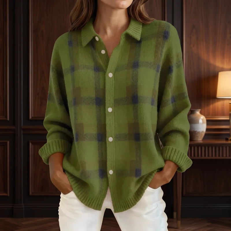 Green cardigan in a dark wood interior