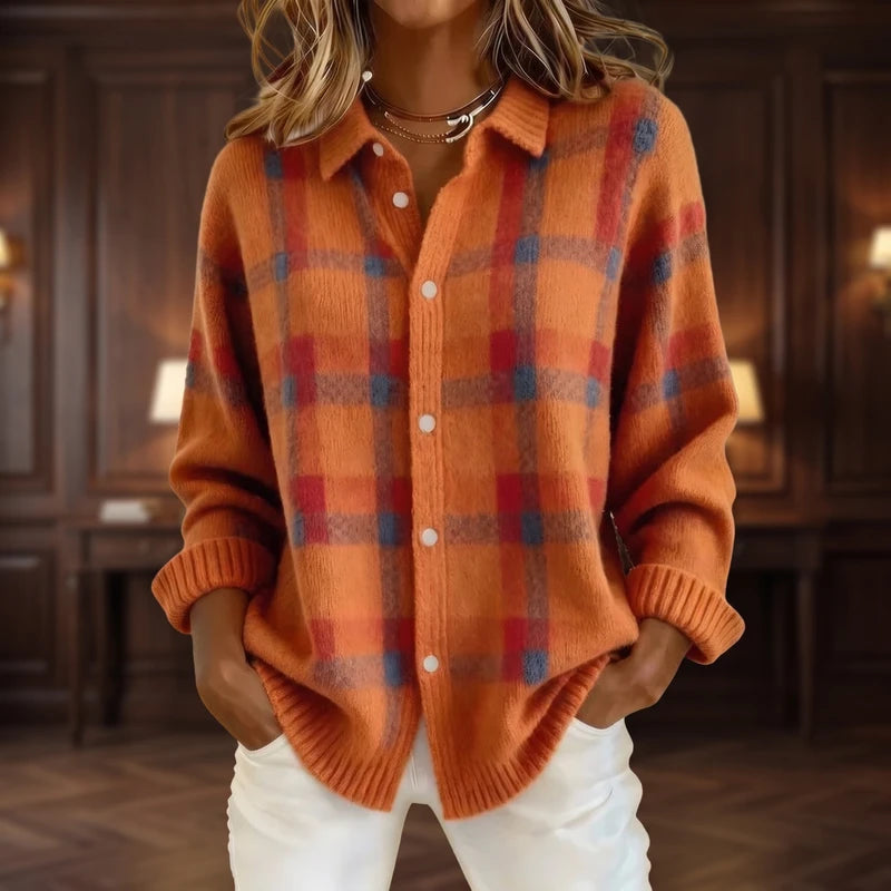 Orange cardigan in a dark wood interior