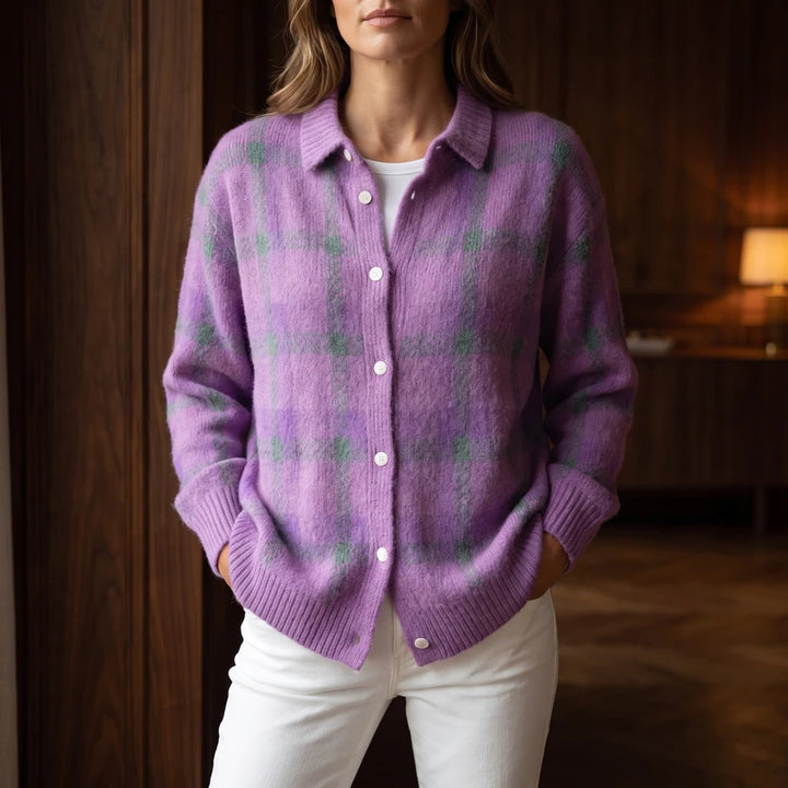 Purple cardigan in a dark wood interior