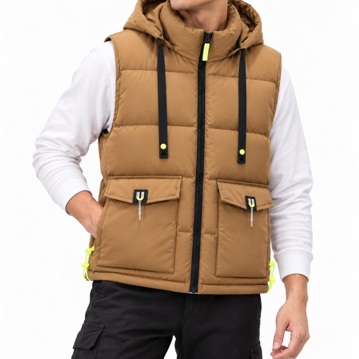Man wearing a brown hooded puffer vest with black zippers, neon yellow accents, and two flap pockets.