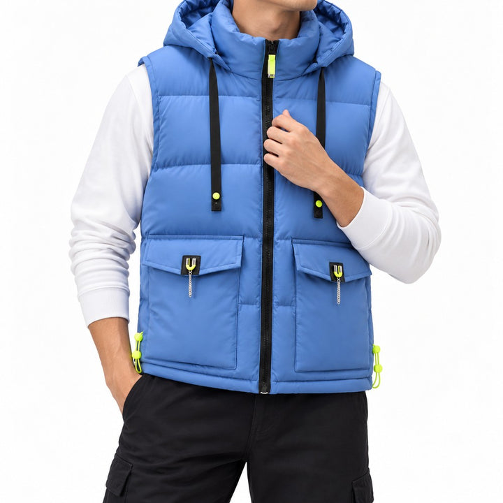 Man wearing a blue hooded puffer vest with black zipper, neon yellow accents, and two front flap pockets.