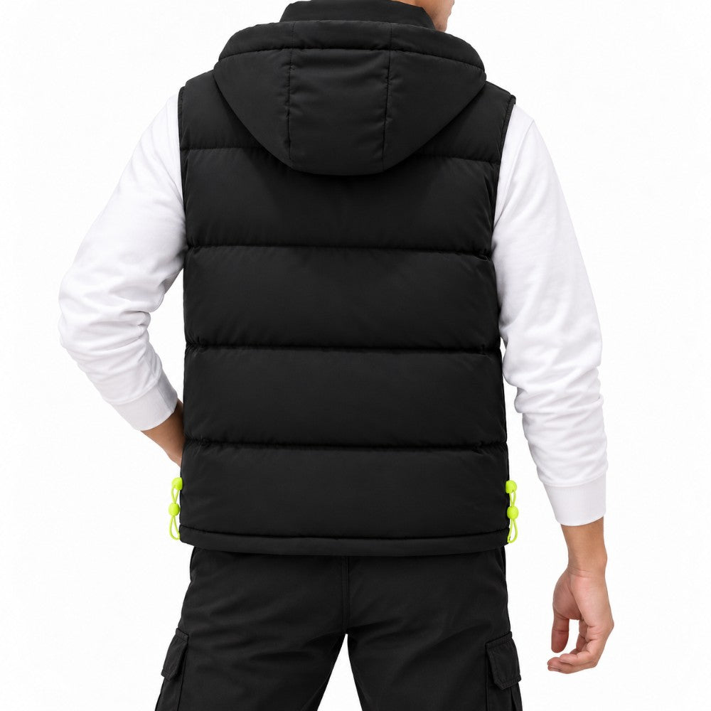 Man wearing a black hooded puffer vest with horizontal quilting, neon green drawstring adjusters, over a white long-sleeve shirt.