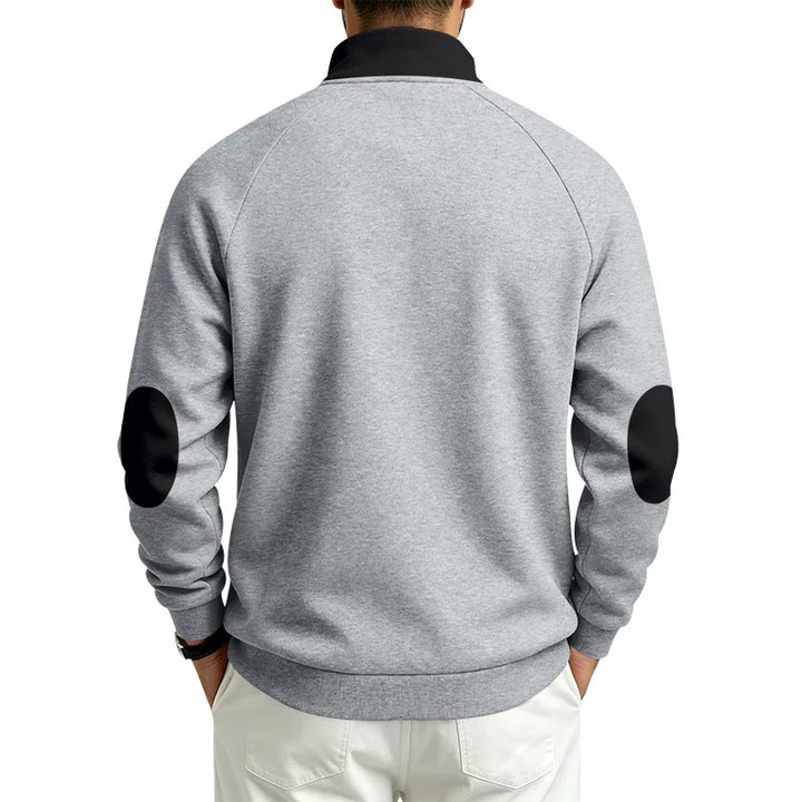 Man wearing a gray long-sleeve sweatshirt with a black collar and black elbow patches, shown from the back view.