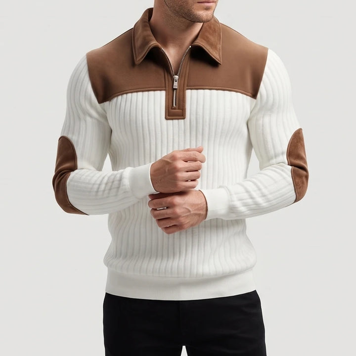 Man wearing a white ribbed quarter-zip sweater with brown suede collar, shoulder panels, and elbow patches.