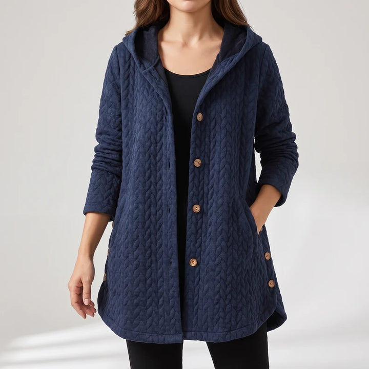 Blue jacket on an off-gray studio background
