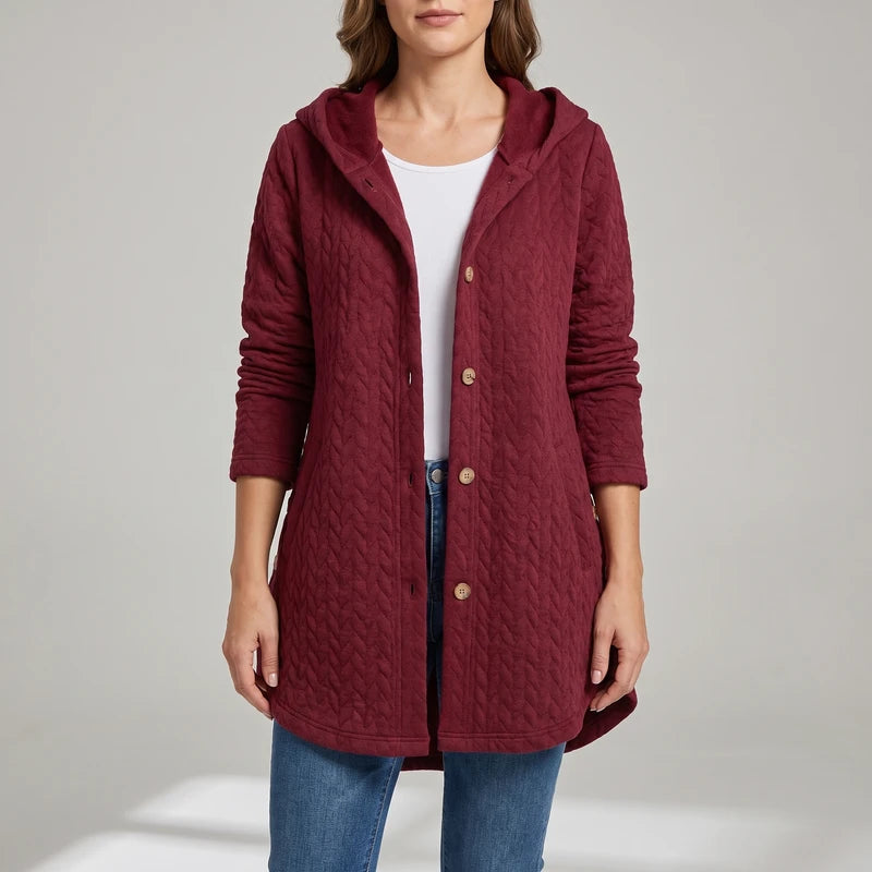 Red jacket on an off-gray studio background