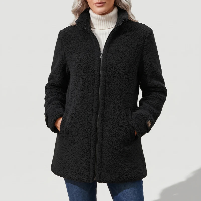 Black coat on an off-gray studio background