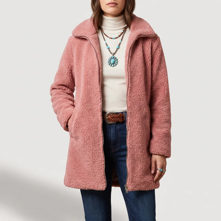 Pink coat on an off-gray studio background