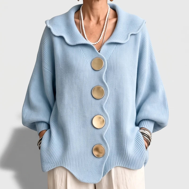 Light  Blue knit cardigan on an off-gray studio background