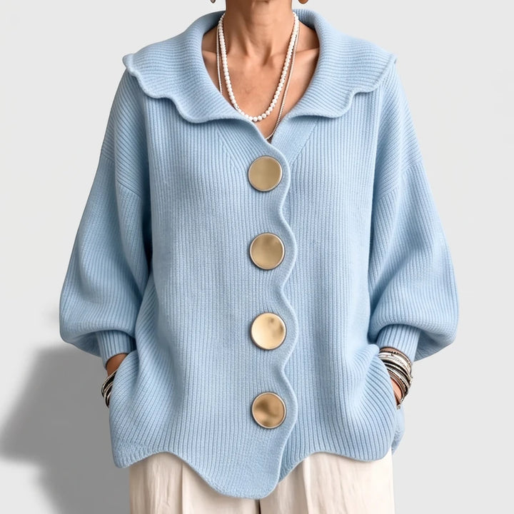 Light  Blue knit cardigan on an off-gray studio background