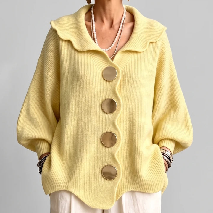 YELLOW knit cardigan on an off-gray studio background