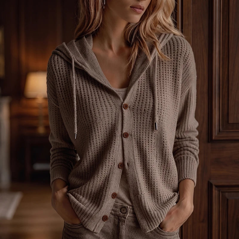 Khaki knit cardigan in a dark wood interior