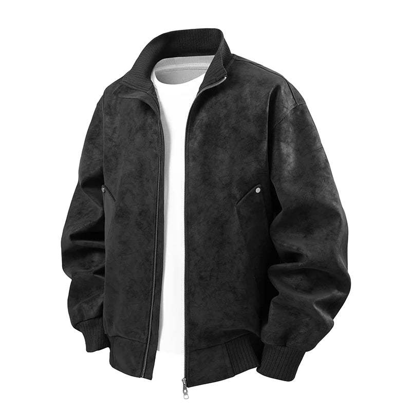 Flat lay of a dark gray textured bomber jacket with a white t-shirt underneath, featuring a silver zipper and ribbed cuffs.