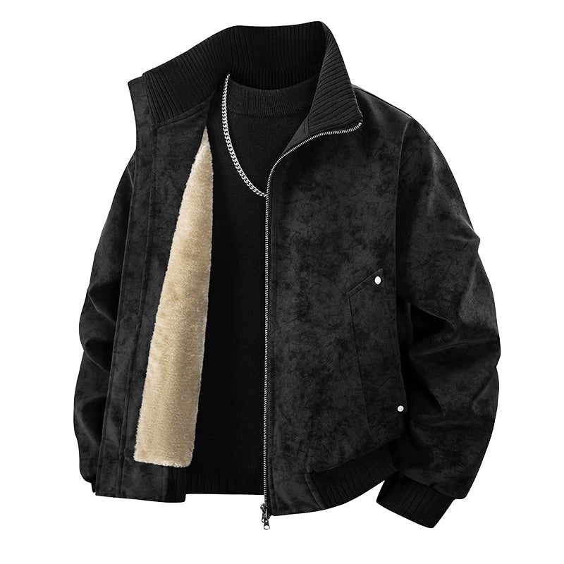 Black bomber jacket with a textured surface, unzipped to reveal plush tan lining and a silver chain.