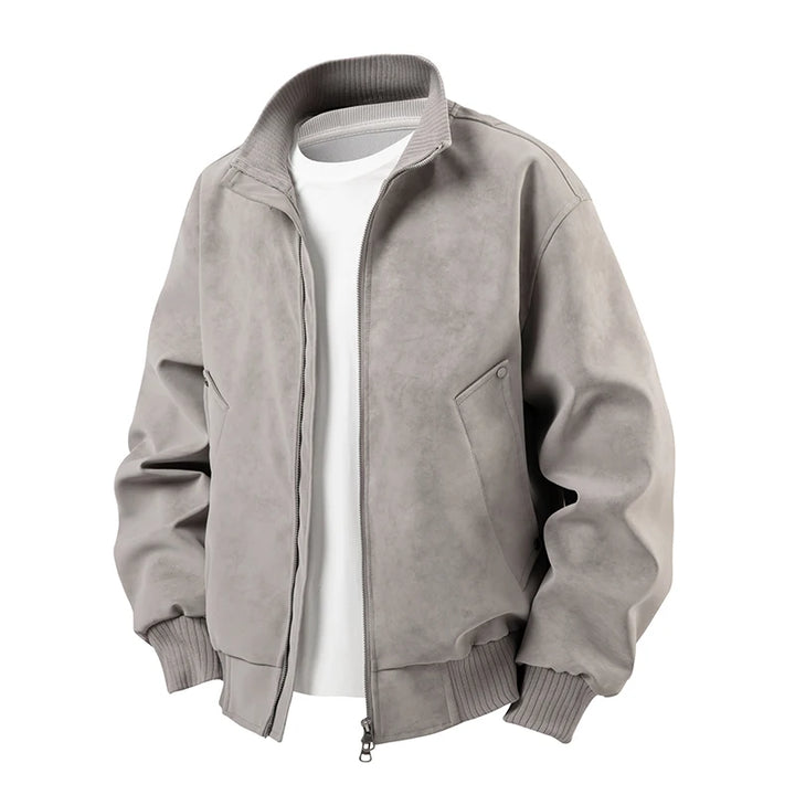 Light gray bomber jacket with a textured suede-like finish, ribbed collar, cuffs, and hem, styled open over a white t-shirt.