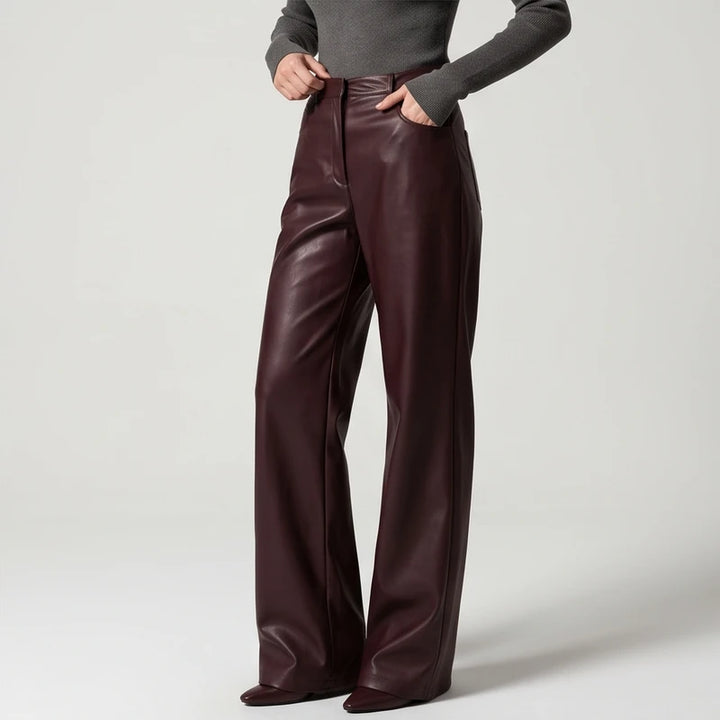 Brown leather pants on an off-gray studio background - 2