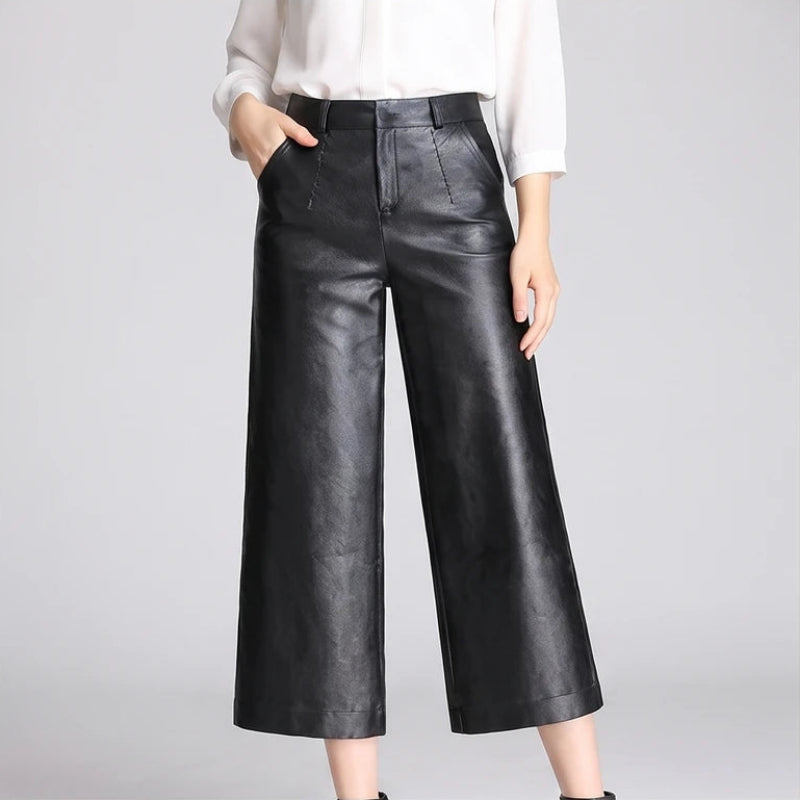 Black leather pants on an off-gray studio background - 2