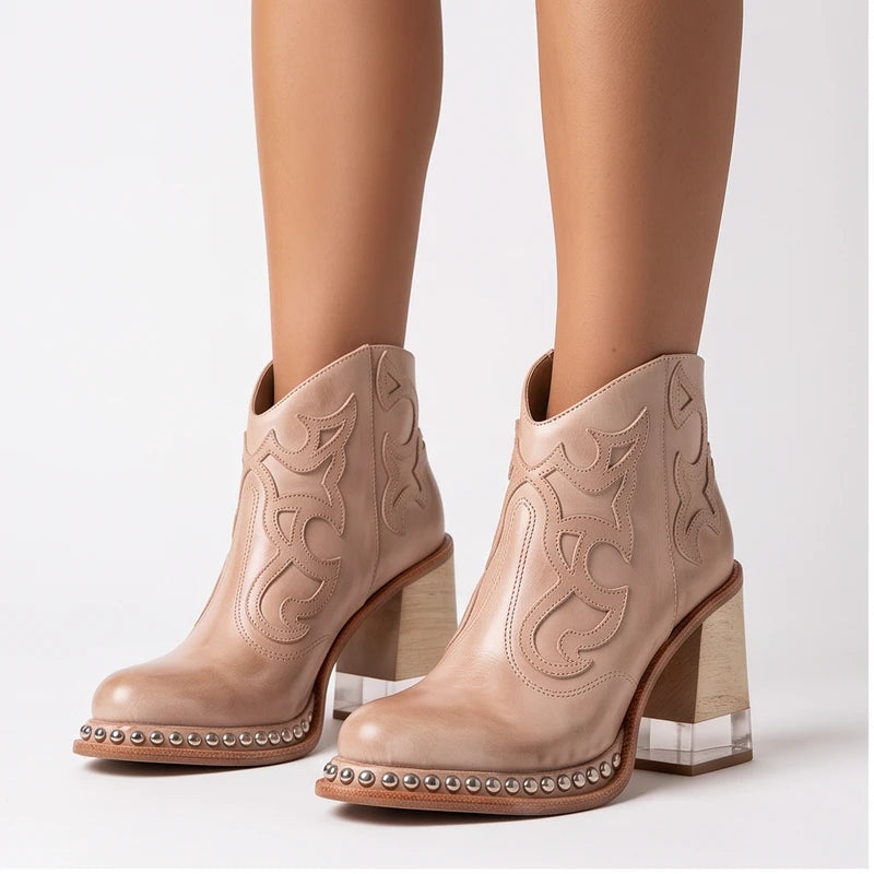 Model wearing Beige leather boots in a studio