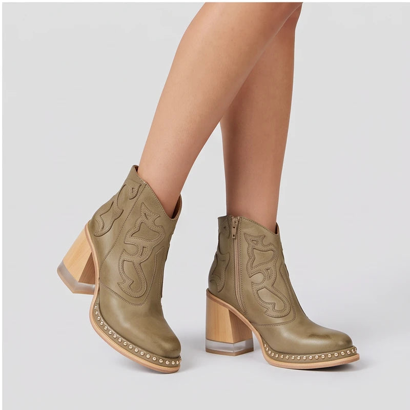 Model wearing Khaki leather boots in a studio - 2
