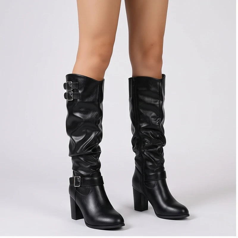 Model wearing Black metal heel in a studio