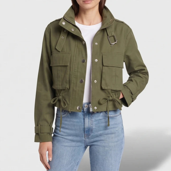 Green jacket on an off-gray studio background - 2