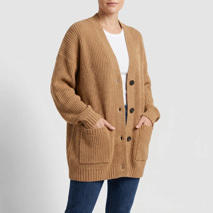Brown knit cardigan on an off-gray studio background