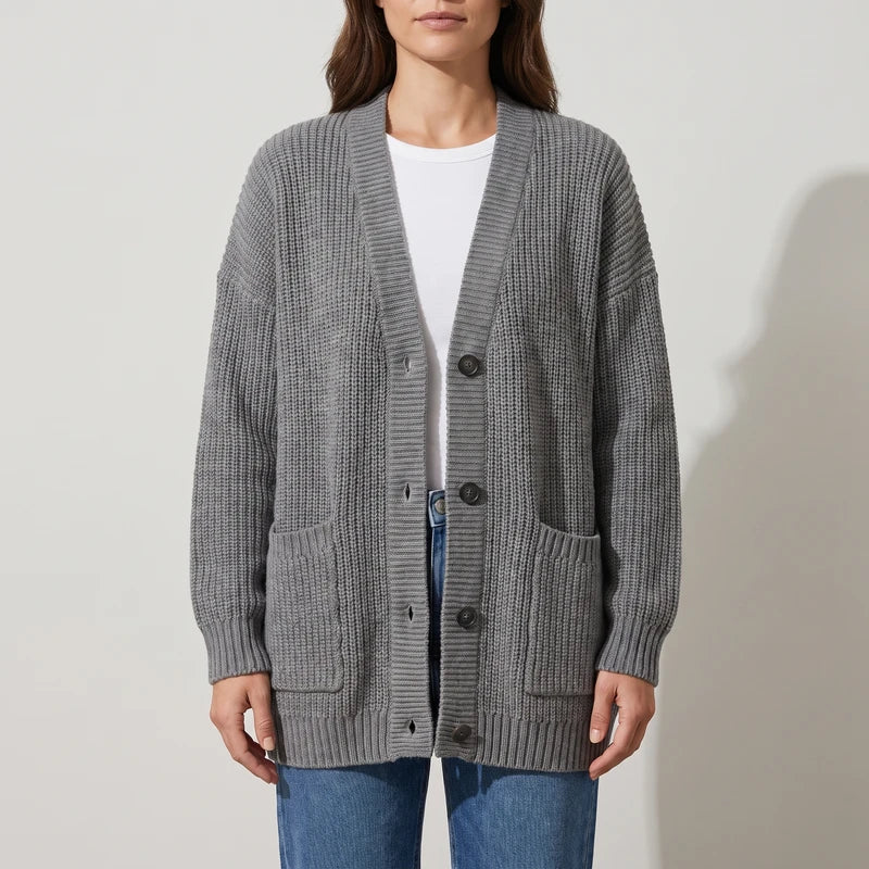 Gray knit cardigan on an off-gray studio background