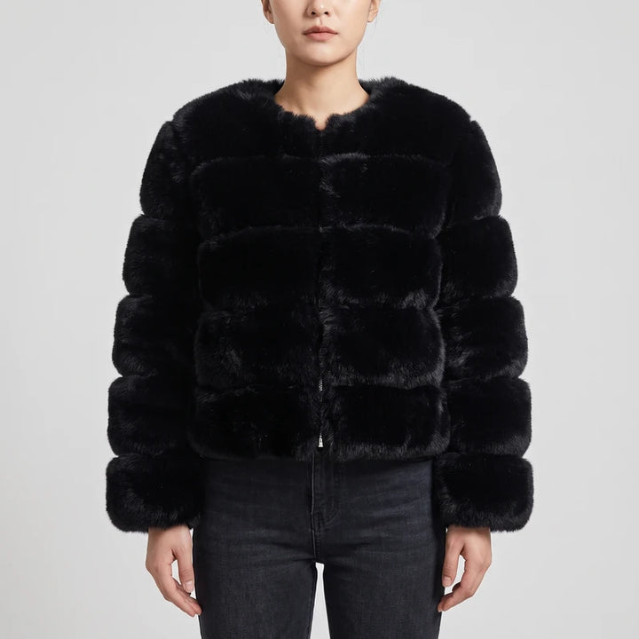 black jacket on an off-gray studio background