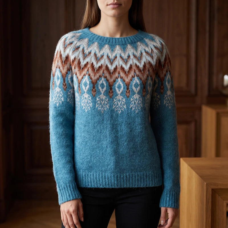 Azure Feather sweater in a dark wood interior
