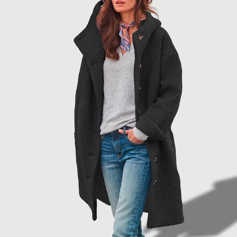 Black coat on an off-gray studio background