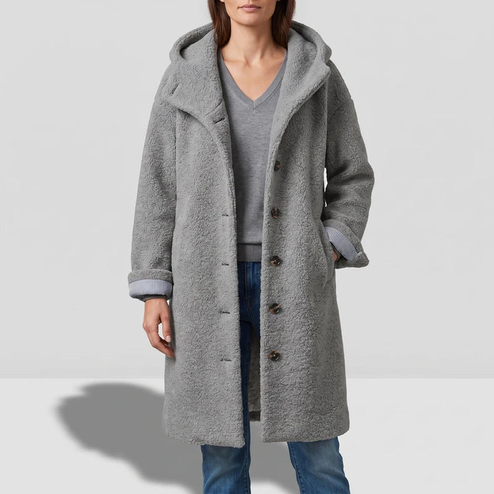 Gray coat on an off-gray studio background