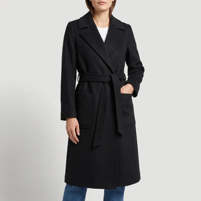 Black wool coat on an off-gray studio background