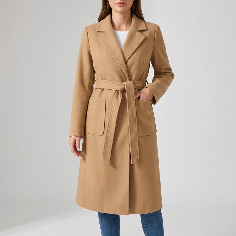 Camel wool coat on an off-gray studio background