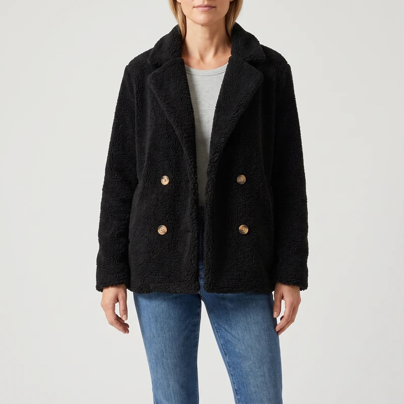 Black wool blazer on an off-gray studio background
