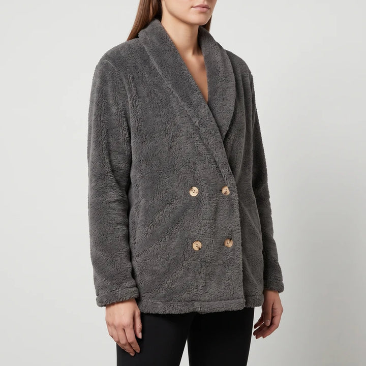 Gray wool blazer on an off-gray studio background