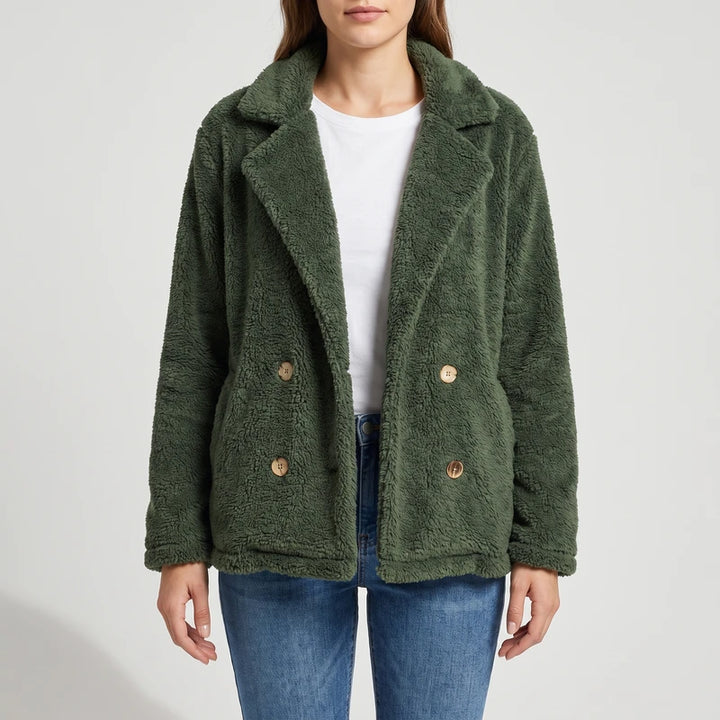 Green wool blazer on an off-gray studio background