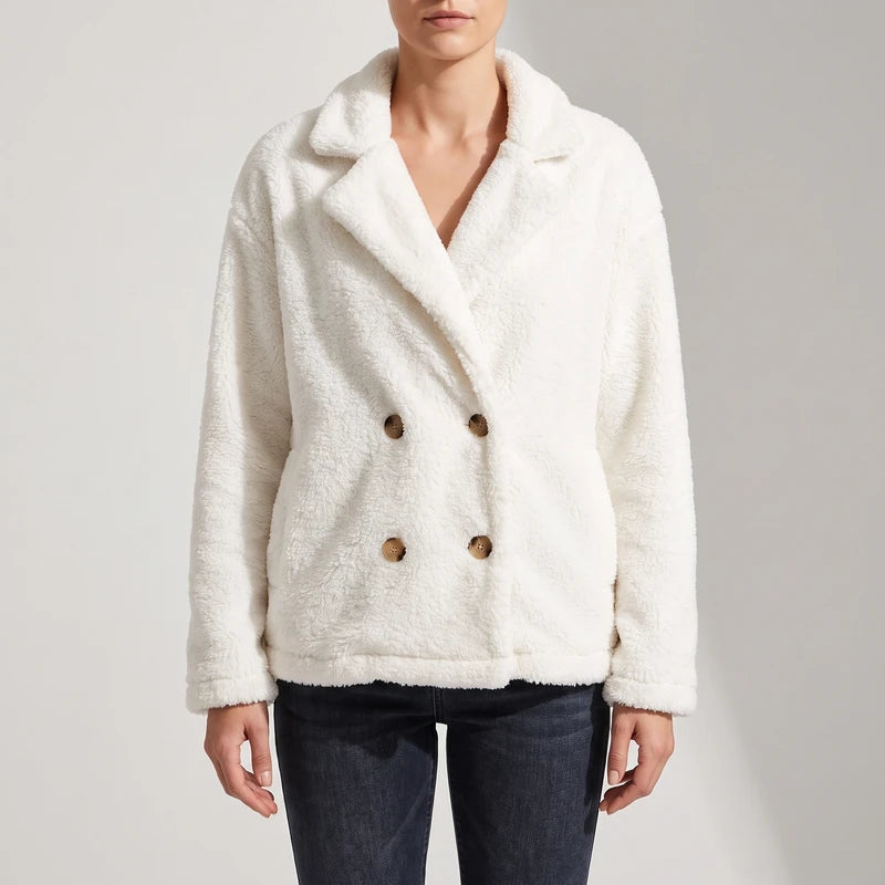 White wool blazer on an off-gray studio background