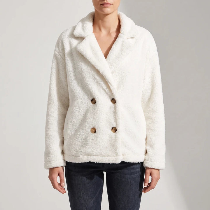 White wool blazer on an off-gray studio background