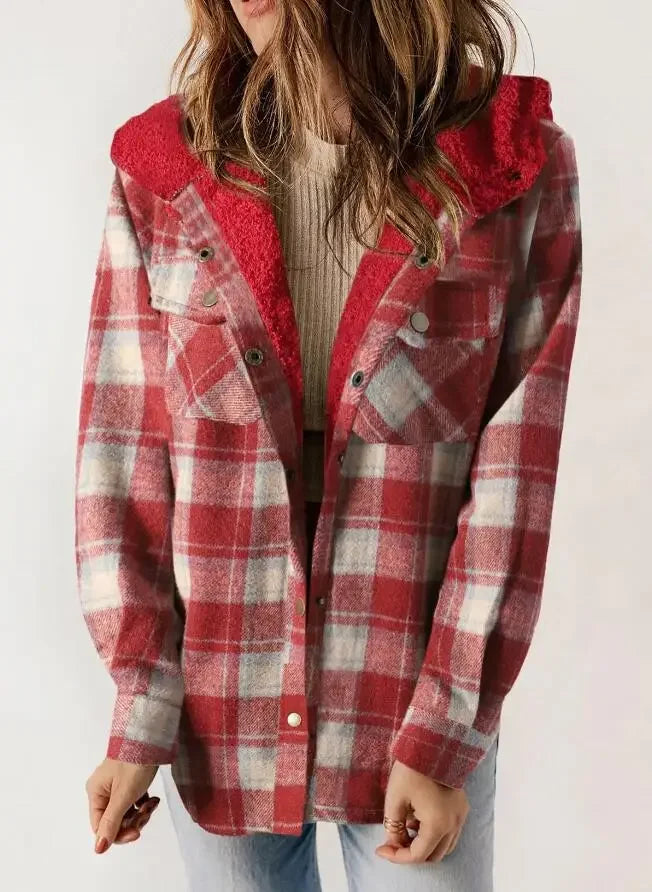 Woman wearing an open red, white, and gray plaid wool jacket with a bright red textured hood.