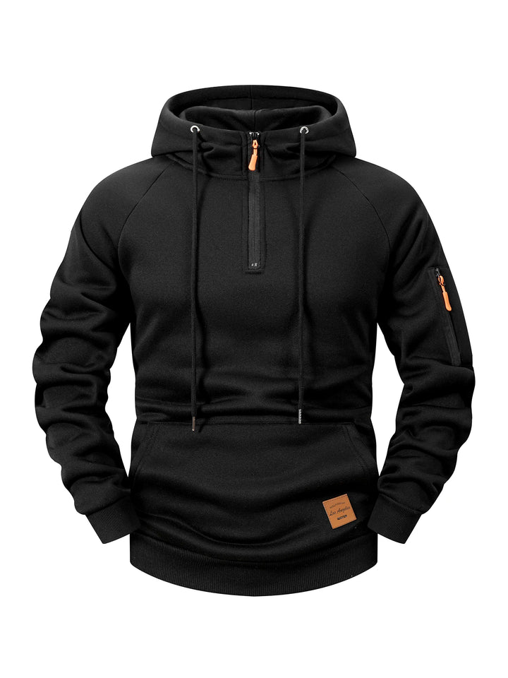 Black fleece hoodie with a partial orange-tipped zipper, drawstring hood, ribbed cuffs, kangaroo pocket, and sleeve zipper pocket.