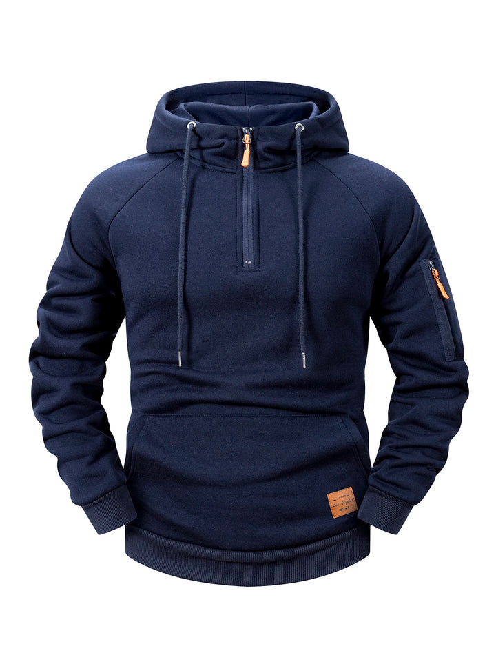 Front view of a dark blue fleece hoodie with a partial zipper and orange zipper pull, drawstrings, and a sleeve pocket.
